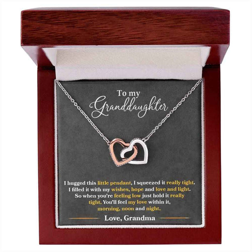 To My Granddaughter, Show her your never-ending loveInterlocking Hearts necklace.
