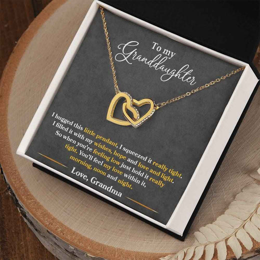 To My Granddaughter, Show her your never-ending loveInterlocking Hearts necklace.