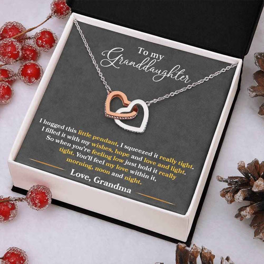 To My Granddaughter, Show her your never-ending loveInterlocking Hearts necklace.
